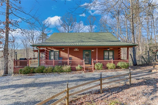 log cabin with covered porch