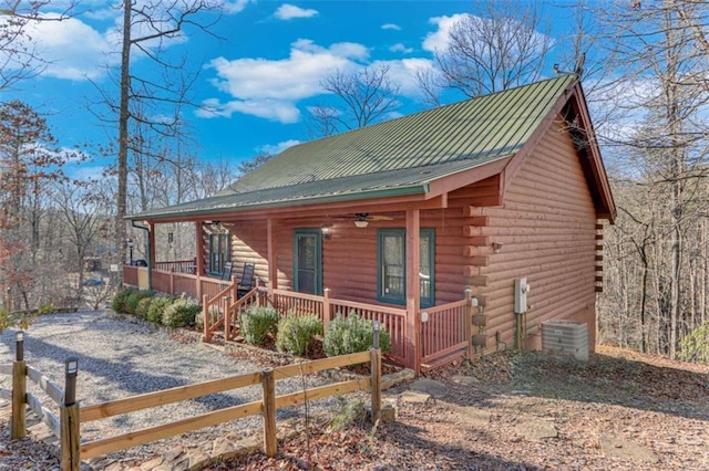 view of front of property with ceiling fan, a porch, and central air condition unit