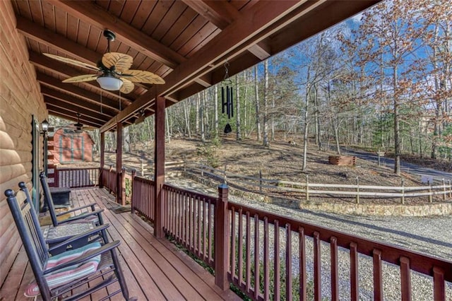 wooden deck featuring ceiling fan