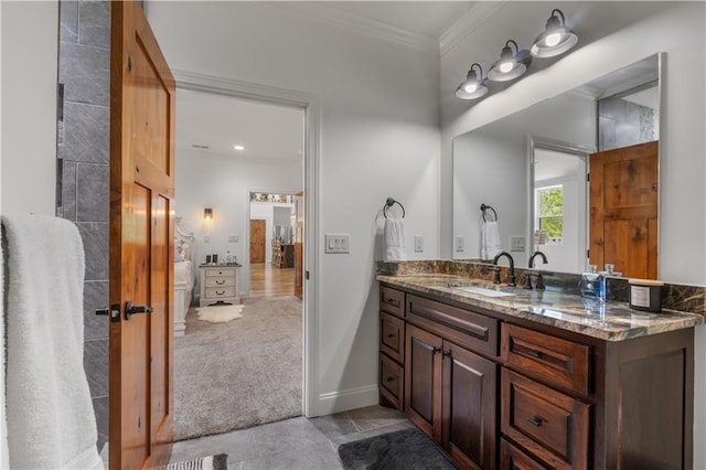 bathroom featuring vanity and crown molding