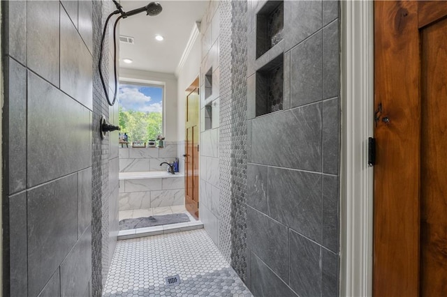 bathroom featuring tile patterned floors, ornamental molding, tile walls, and independent shower and bath