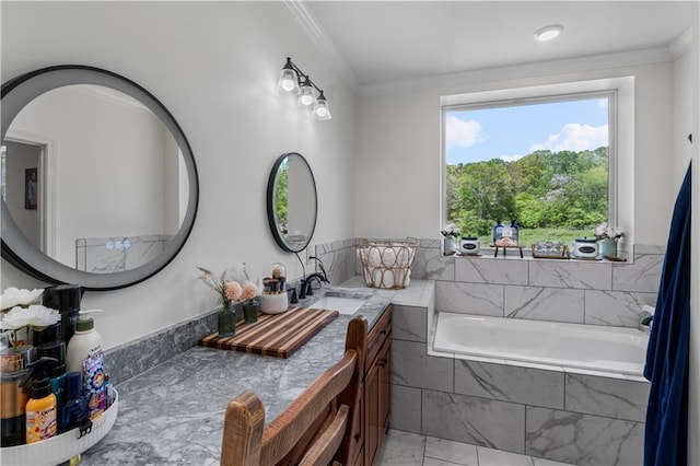 bathroom featuring vanity, crown molding, and tiled tub