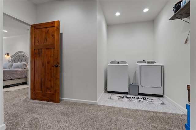 washroom with light carpet and washer and clothes dryer