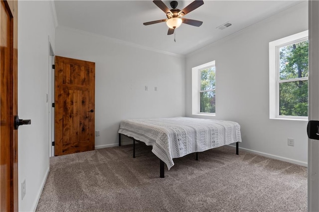 bedroom with carpet flooring, ceiling fan, and ornamental molding