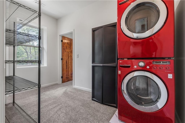 washroom featuring carpet floors and stacked washer and clothes dryer