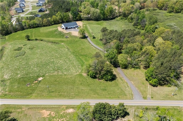 birds eye view of property featuring a rural view