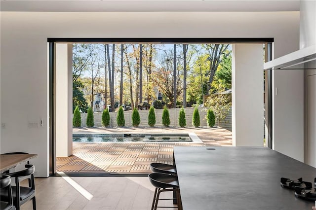 doorway to outside featuring wood finished floors