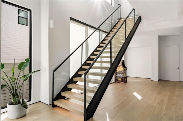 staircase featuring wood finished floors