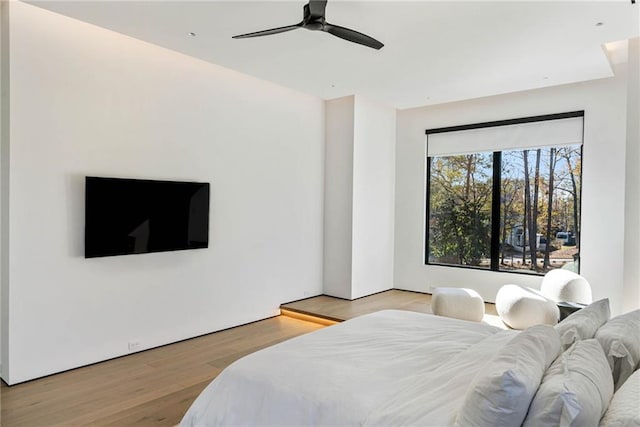 bedroom featuring a ceiling fan and wood finished floors