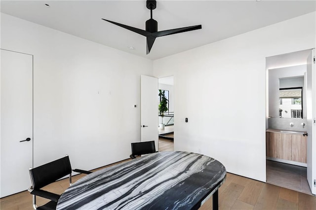 bedroom featuring light wood-type flooring and a ceiling fan