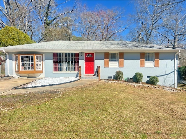 ranch-style home with crawl space, brick siding, a shingled roof, and a front yard