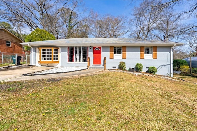 ranch-style home with crawl space, brick siding, a front yard, and fence