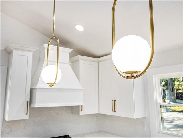 interior details with recessed lighting, white cabinets, and pendant lighting