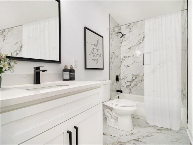 bathroom with vanity, toilet, marble finish floor, and shower / tub combo