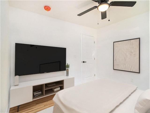 bedroom with wood finished floors and ceiling fan