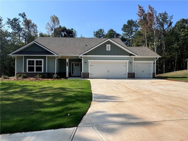 craftsman-style house with a garage and a front lawn