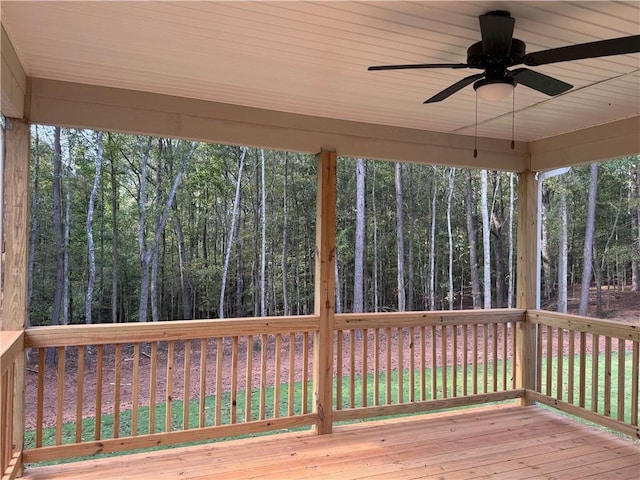 wooden deck featuring ceiling fan