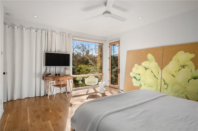 bedroom with ceiling fan and light hardwood / wood-style flooring