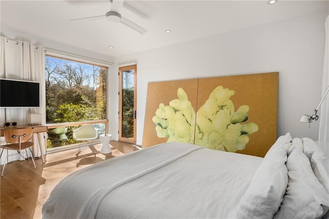 bedroom featuring light hardwood / wood-style floors and ceiling fan