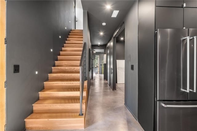 stairway with concrete floors