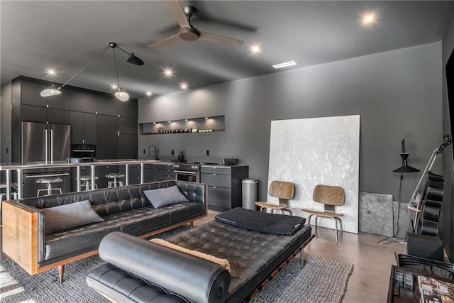 living room featuring wet bar and ceiling fan