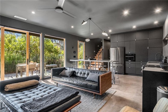 interior space featuring sink and ceiling fan