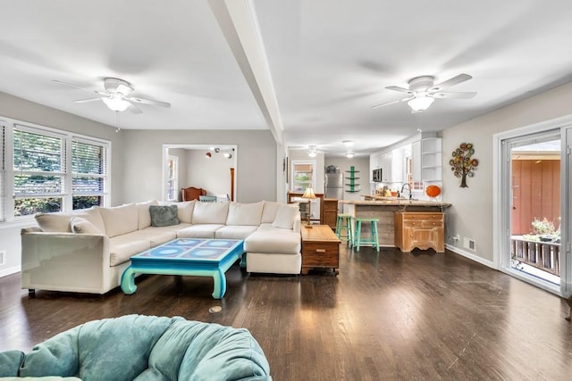 5400 Francis Ave, Stone Mountain, GA 30087 - living room featuring a ceiling fan, dark wood-style floors, and baseboards