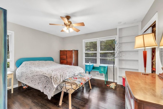 5400 Francis Ave, Stone Mountain, GA 30087 - bedroom with dark wood-style flooring, baseboards, and ceiling fan
