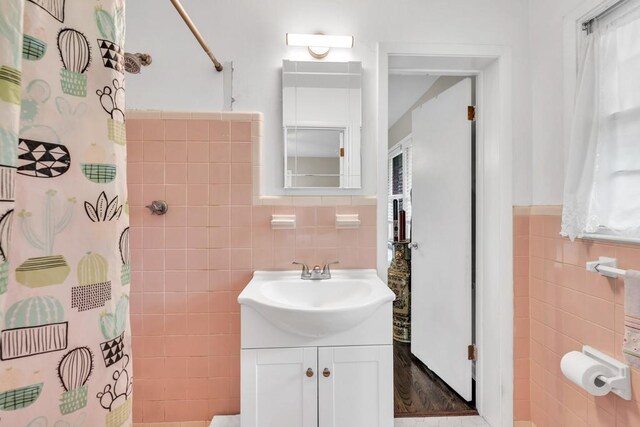 5400 Francis Ave, Stone Mountain, GA 30087 - full bath with tile walls, vanity, a shower with curtain, and wainscoting
