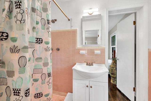 5400 Francis Ave, Stone Mountain, GA 30087 - full bath with tile walls, vanity, a shower with curtain, and wood finished floors