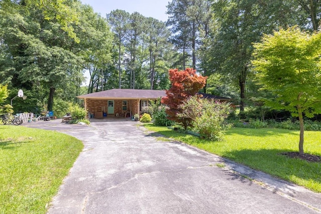5400 Francis Ave, Stone Mountain, GA 30087 - single story home with driveway, a front lawn, and an attached carport