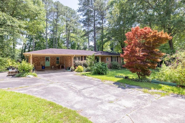 5400 Francis Ave, Stone Mountain, GA 30087 - single story home with driveway, a carport, and a front lawn