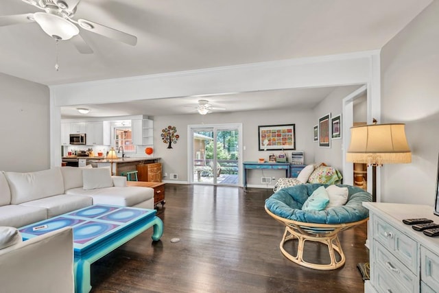5400 Francis Ave, Stone Mountain, GA 30087 - living area with ceiling fan, dark wood-type flooring, ornamental molding, and baseboards