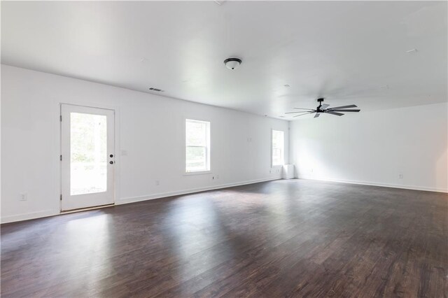 empty room featuring ceiling fan and dark hardwood / wood-style flooring