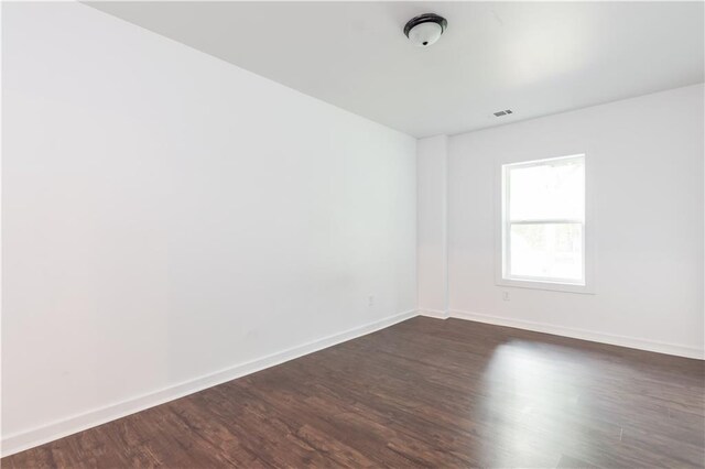 empty room featuring dark hardwood / wood-style floors