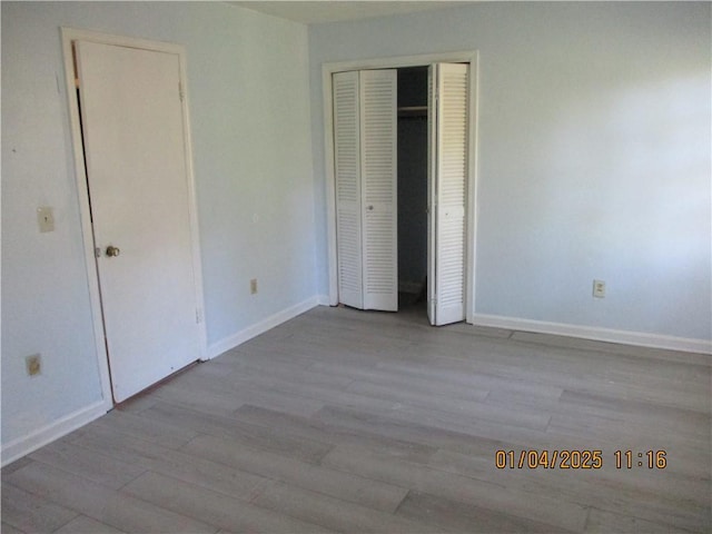 unfurnished bedroom featuring light wood-type flooring