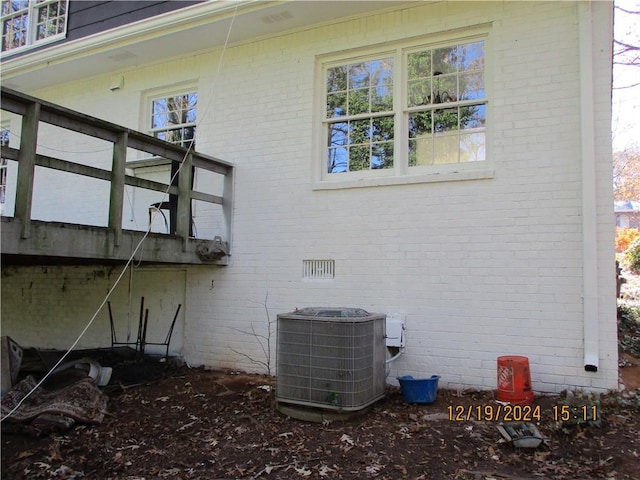 view of side of property with cooling unit