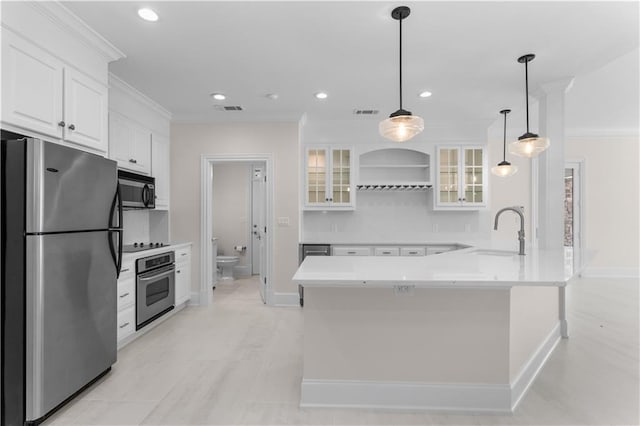 1070 Prosperity Pt, Greensboro, GA 30642 - kitchen featuring appliances with stainless steel finishes, a sink, ornamental molding, white cabinetry, and recessed lighting