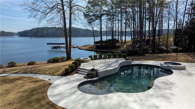 1070 Prosperity Pt, Greensboro, GA 30642 - view of swimming pool featuring a water view, a dock, a pool with connected hot tub, and a patio area