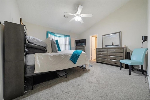 carpeted bedroom featuring vaulted ceiling and ceiling fan