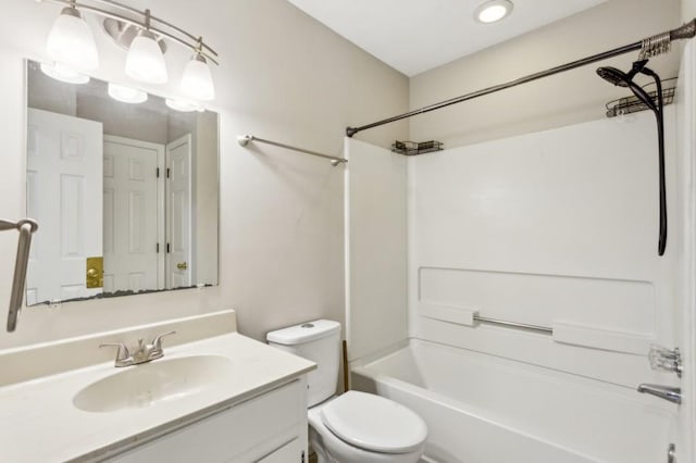 bathroom with toilet, tub / shower combination, and vanity