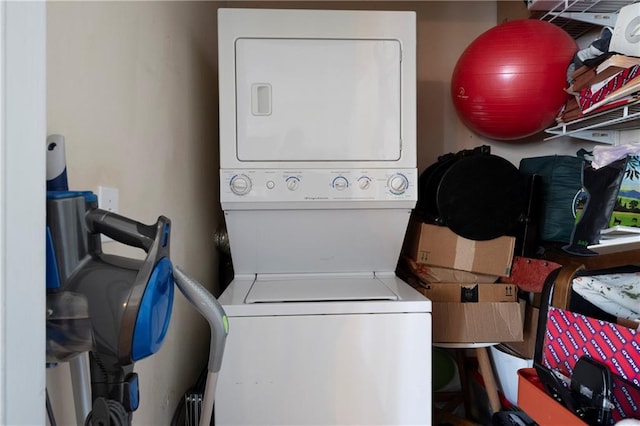 laundry room with stacked washer and clothes dryer