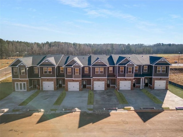 253 Ivey Ter Unit 48, Temple, GA 30179 - aerial perspective of suburban area featuring a heavily wooded area