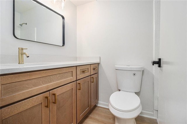 657 Stratford Green Way, Avondale Estates, GA 30002 - bathroom with vanity, toilet, baseboards, and wood finished floors