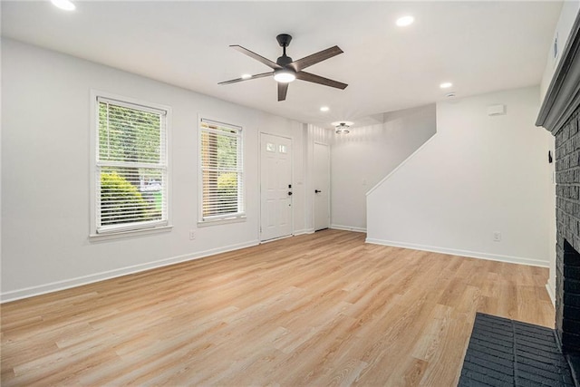 657 Stratford Green Way, Avondale Estates, GA 30002 - entryway with a brick fireplace, a ceiling fan, light wood finished floors, recessed lighting, and baseboards