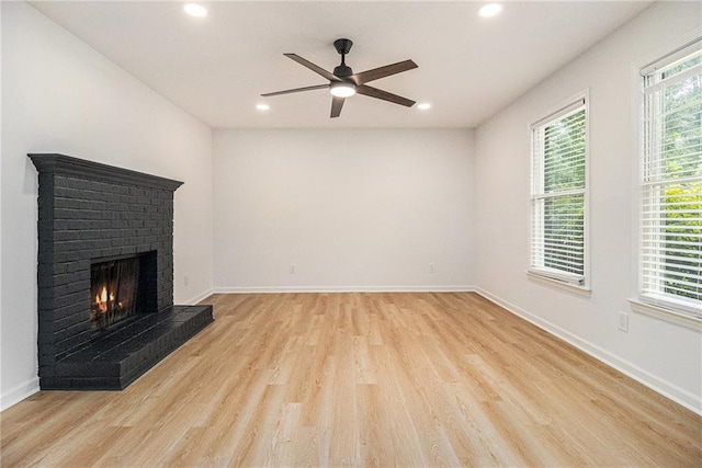 657 Stratford Green Way, Avondale Estates, GA 30002 - unfurnished living room featuring light wood finished floors, a ceiling fan, recessed lighting, a brick fireplace, and baseboards