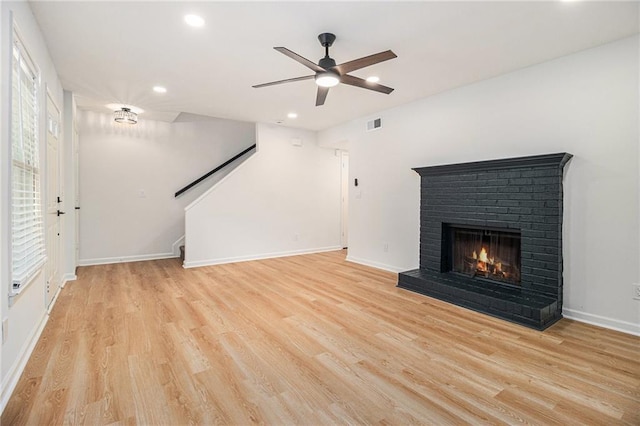 657 Stratford Green Way, Avondale Estates, GA 30002 - unfurnished living room featuring recessed lighting, a brick fireplace, light wood finished floors, a ceiling fan, and baseboards