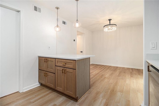 657 Stratford Green Way, Avondale Estates, GA 30002 - kitchen with light wood-style floors, light countertops, a chandelier, and decorative light fixtures