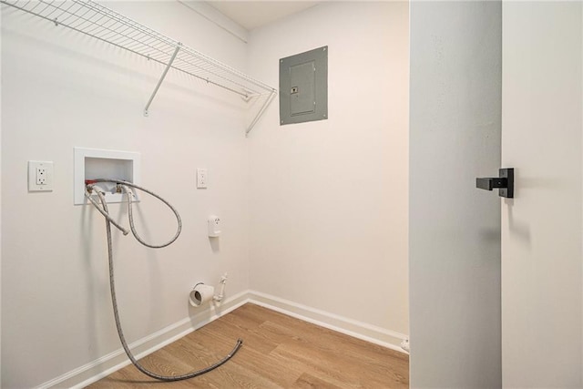 657 Stratford Green Way, Avondale Estates, GA 30002 - washroom with washer hookup, electric panel, gas dryer hookup, wood finished floors, and baseboards