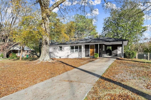 single story home with a carport